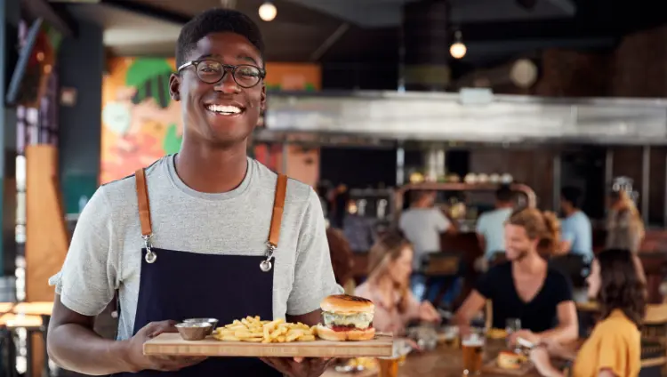 waiter bring food in a restaurant