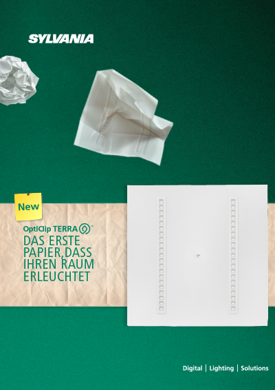 A SYLVANIA promotional graphic featuring the product OptiClip TERRA™, displayed as a flat white square lighting panel with two vertical rows of small rectangular elements. The background is a green textured surface with two pieces of crumpled white paper at the top and a strip of beige paper across the middle containing German text. A yellow tag labeled “New” appears near the product name.